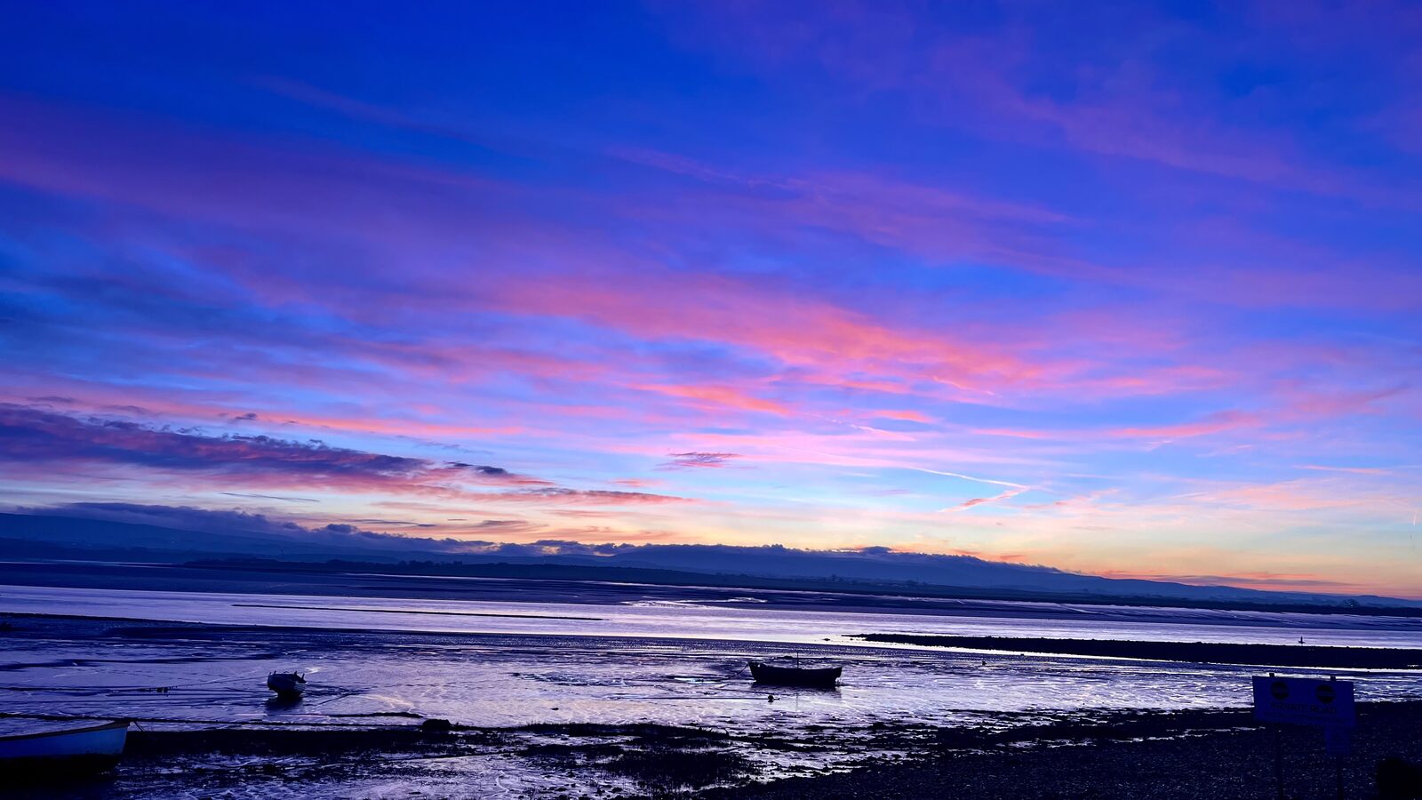 Balanced stones at Sunderland Point estuary at golden hour